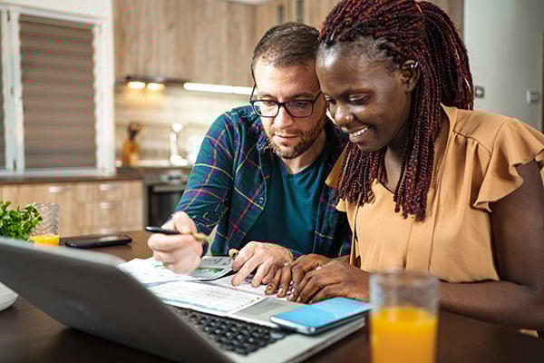 Couple reviewing health insurance documents