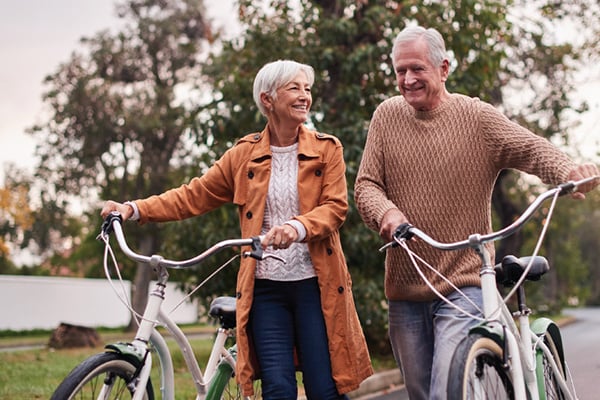Senior couple riding bikes