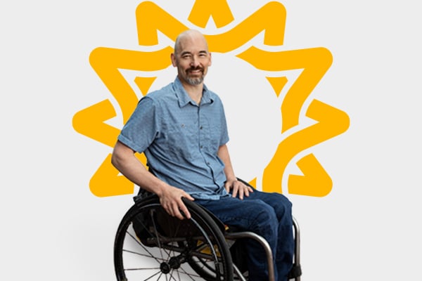 Man smiling in wheelchair