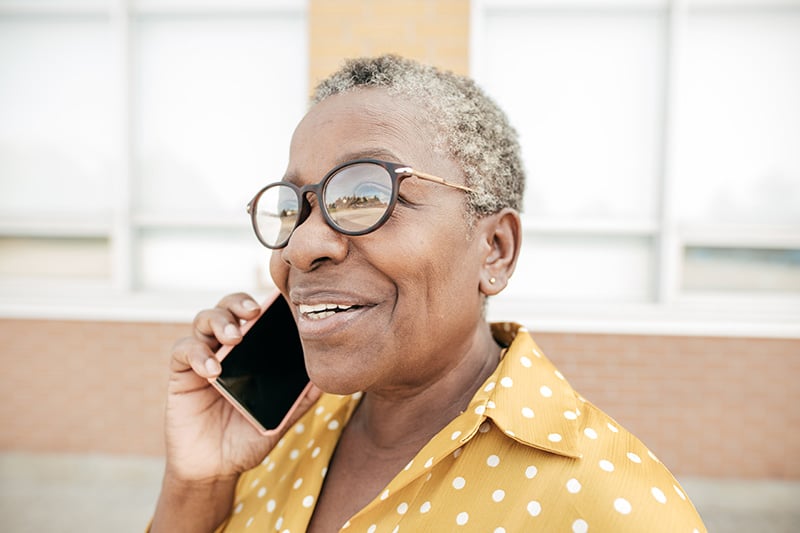 Older woman talks on cell phone
